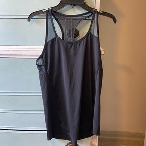 Athletic tank top. Hardly worn. Tag was cut out but it is either a small or xs.